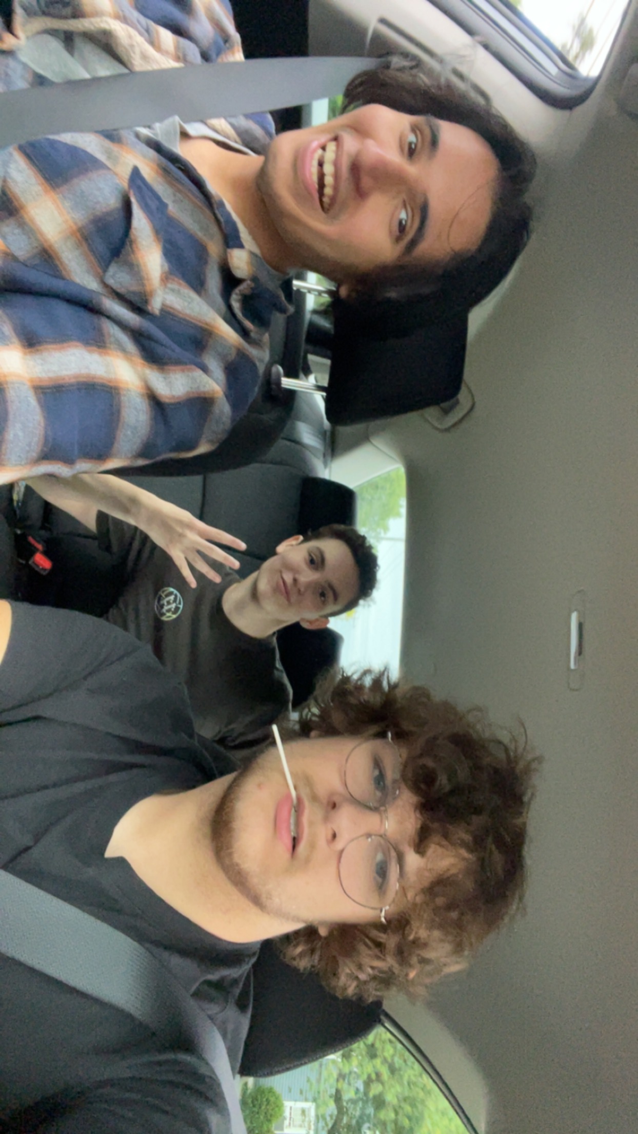 a picture of me in a car with two of my friends